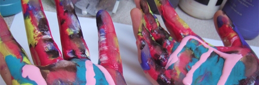 arty picture of hands covered in paint